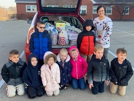 Students from Immaculate Conception School in Loose Creek deliver items they collected for resettling refugees.